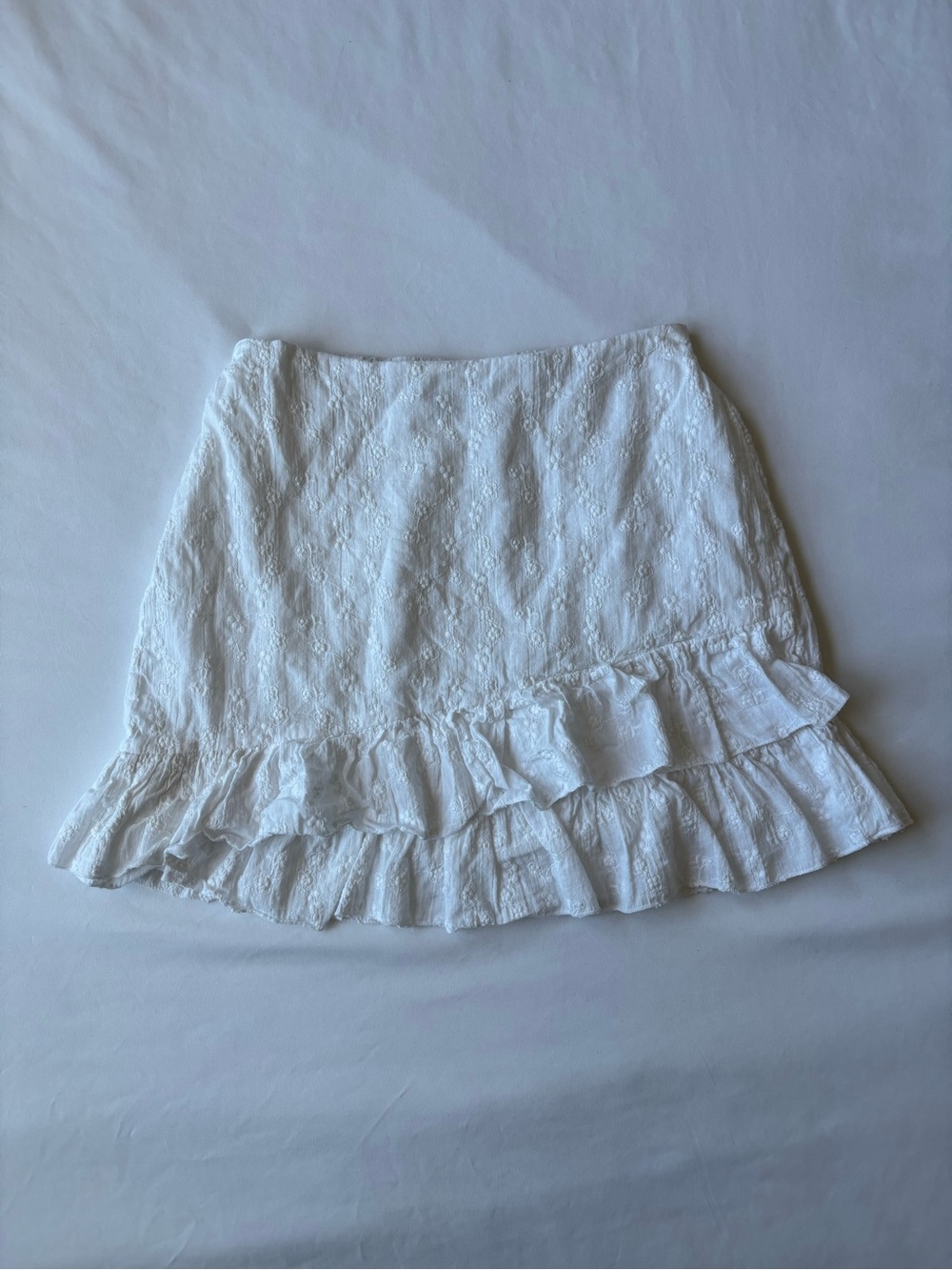 White floral mini linen skirt with ruffle hem